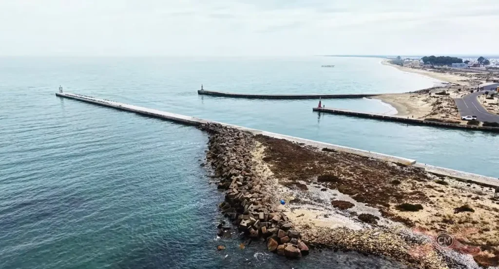 Photo of Laaiplek Harbour featuring its three lighthouses, where the Berg River meets the Atlantic Ocean in Velddrif, Western Cape, South Africa.